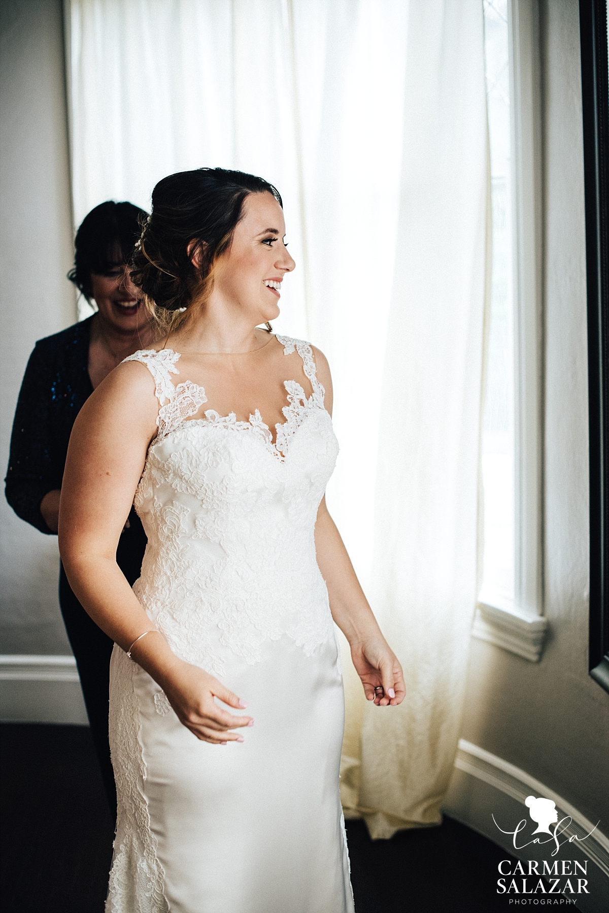 Laughing bride getting dressed at Vizcaya - Carmen Salazar