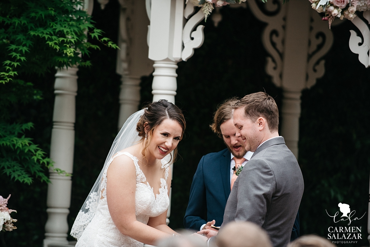 Happy bride and groom at ceremony - Carmen Salazar