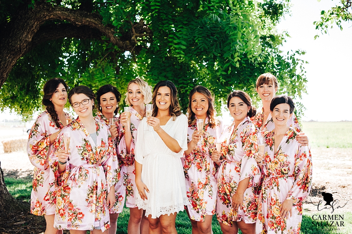 Bridemaids toasting outside with champagne - Carmen Salazar 