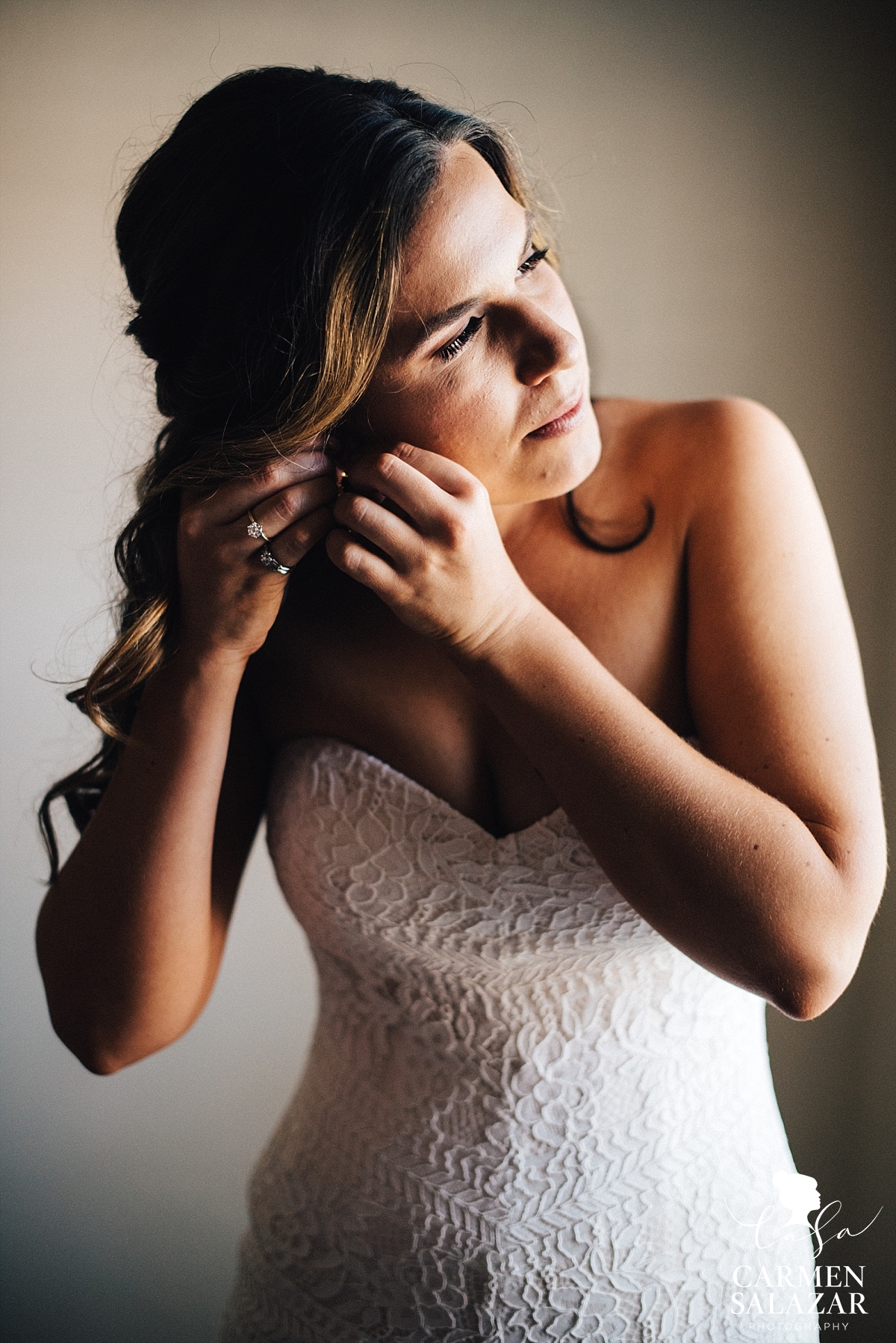 Bride getting ready in bohemian lace gown - Carmen Salazar 