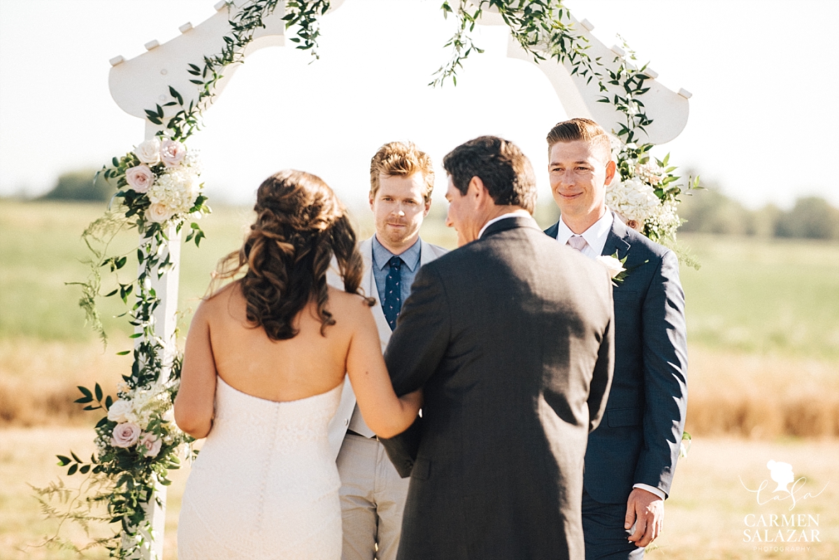 Groom's first look at bride during ceremony - Carmen Salazar 