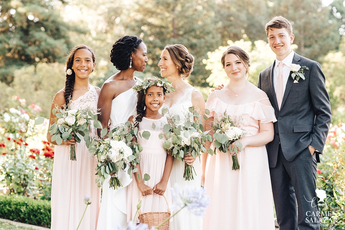 Happy family with the brides in McKinley Rose Garden - Carmen Salazar