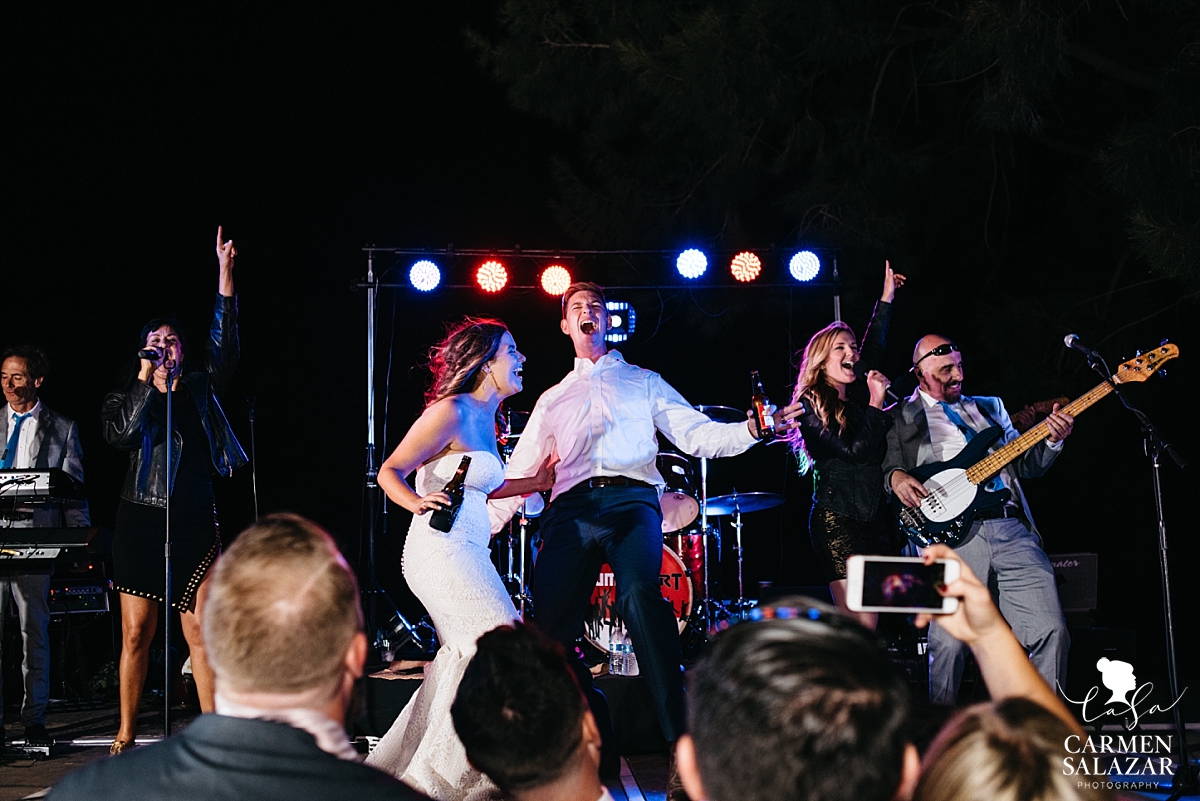 Bride and groom singing Journey onstage - Carmen Salazar 