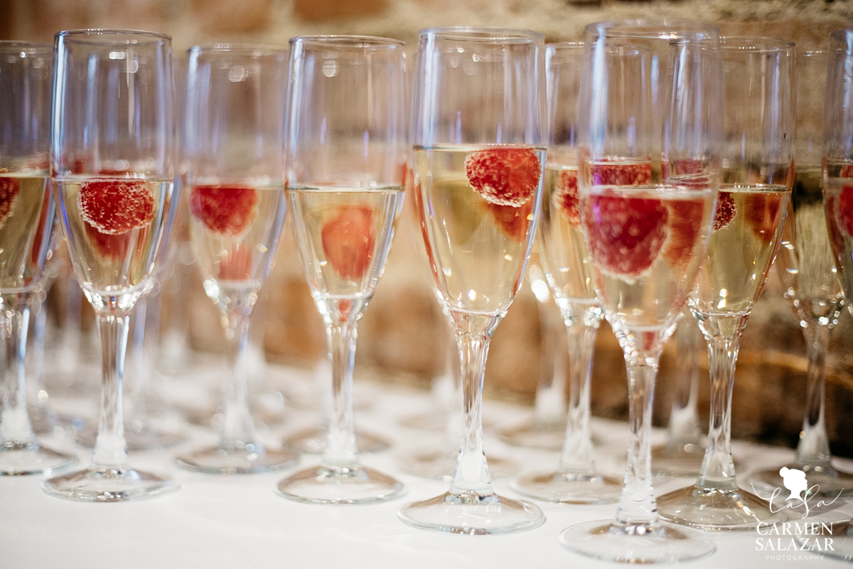 champagne glasses with raspberries with Sacramento event photographer Carmen Salazar