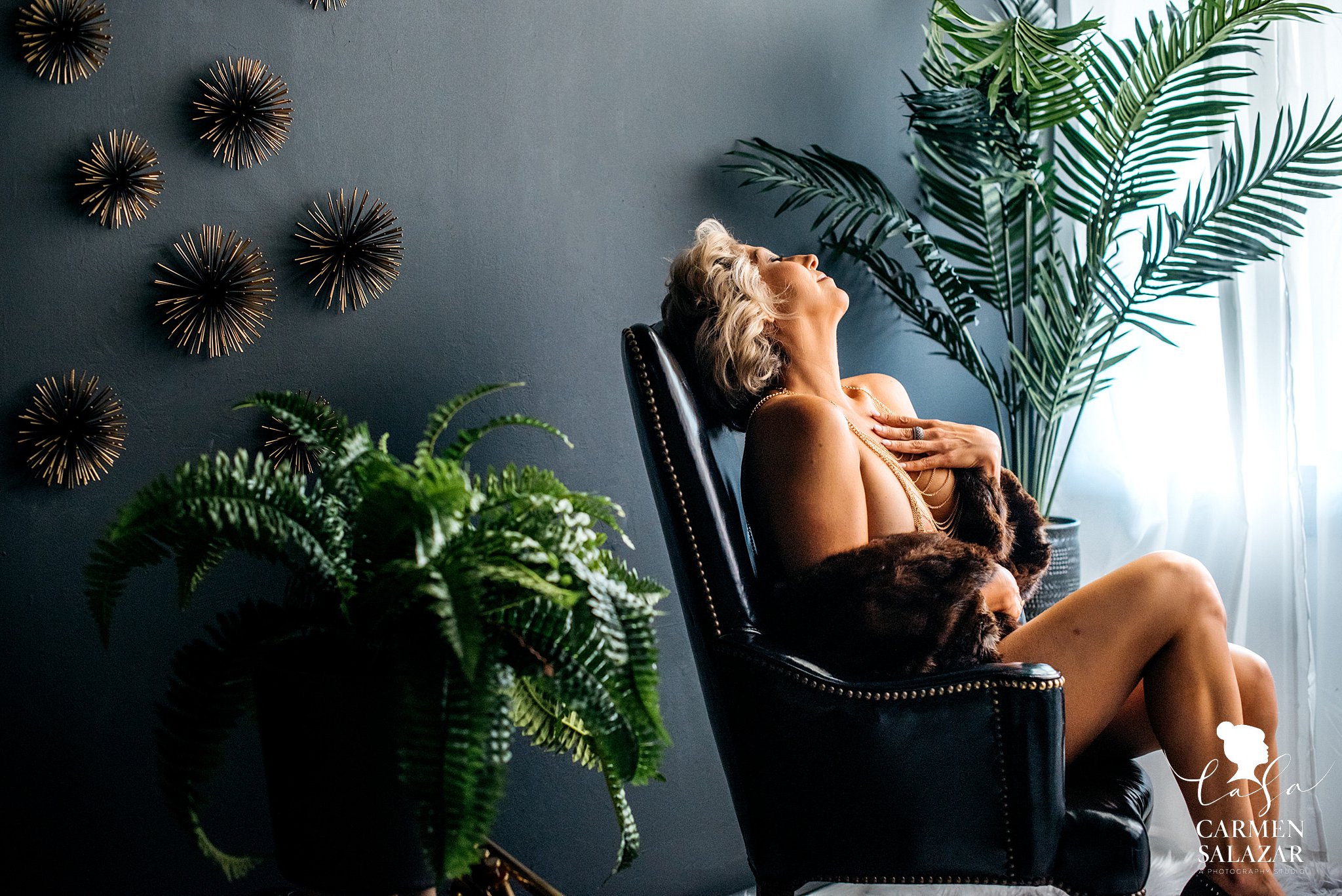 Stunning natural light boudoir photo of a woman on a chair by Sacramento Boudoir photographer Carmen Salazar