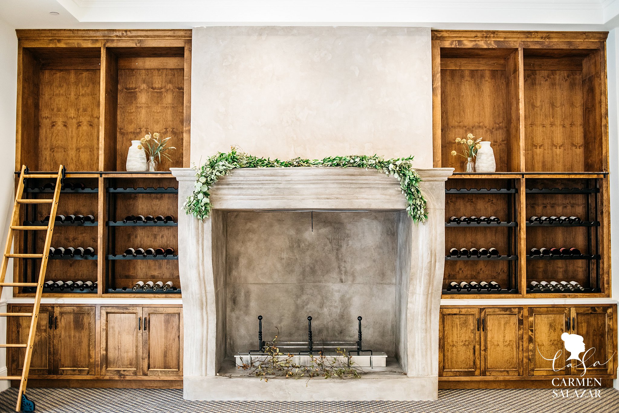 Rustic fireplace with wine cellar in wedding venue 