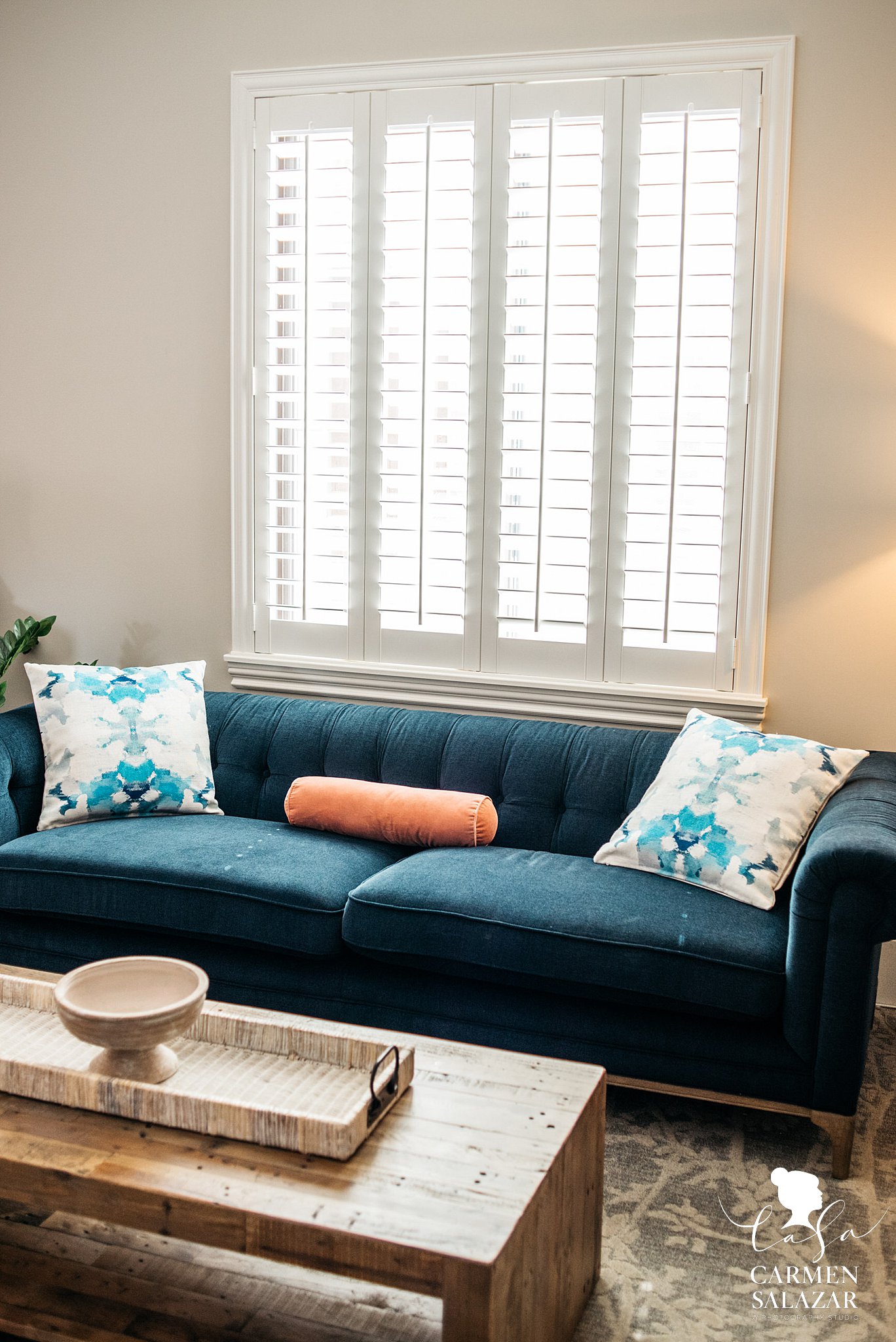 Hotel interior with natural light and blue couch 